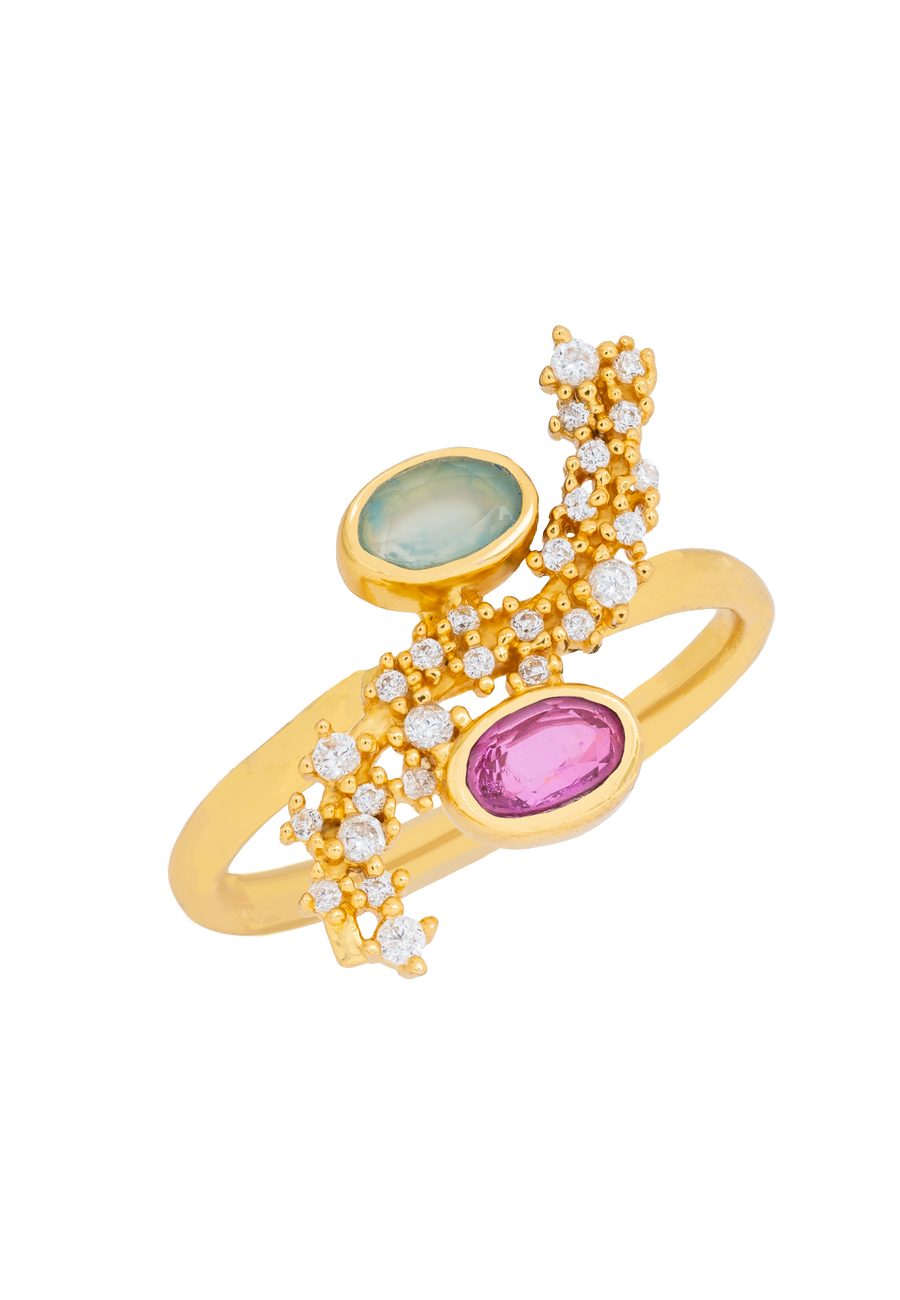 Anillo asimétrico Cassara con piedras en aguamarinay fucisa