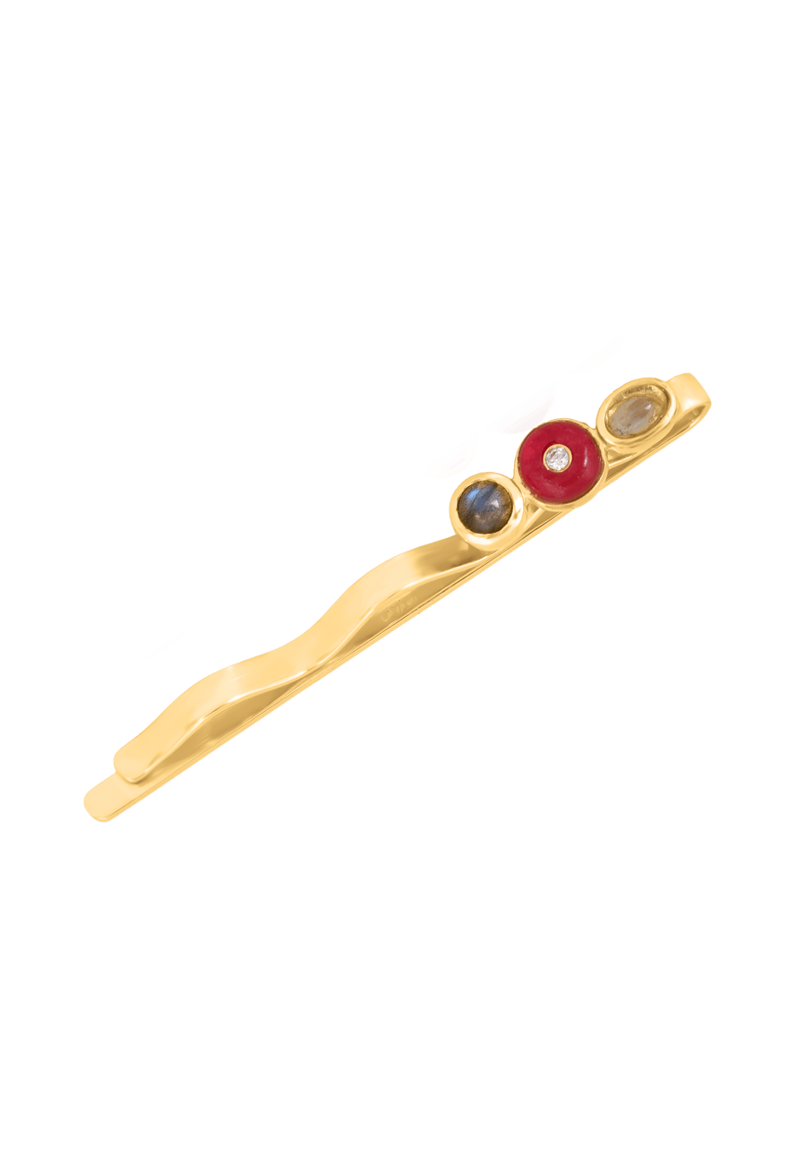 Horquilla de pelo multicolor con piedras naturales en blanco, rojo y gris.