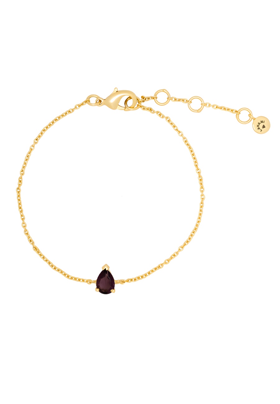 Pulsera dorada minimalista con piedra natural en morado.
