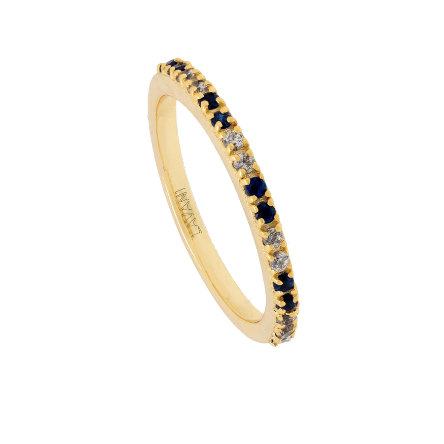 Anillo dorado con circonitas azules.