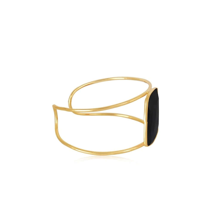 Perfil de brazalete dorado con piedra natural negra de Lavani Jewels