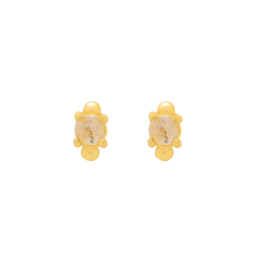 Piercing dorado adornado con una circonita blanca.